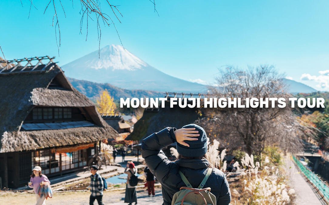 Traveler viewing Mount Fuji from a traditional Japanese village, Tokyo MegaPass tour.