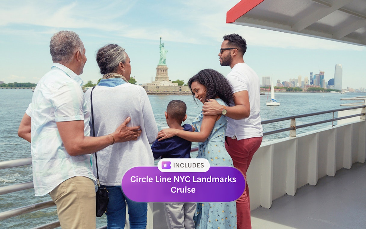 Family enjoying views of the Statue of Liberty on a Circle Line NYC cruise.