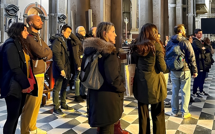 Visitors listening to a historian inside Sansevero Chapel, Naples.