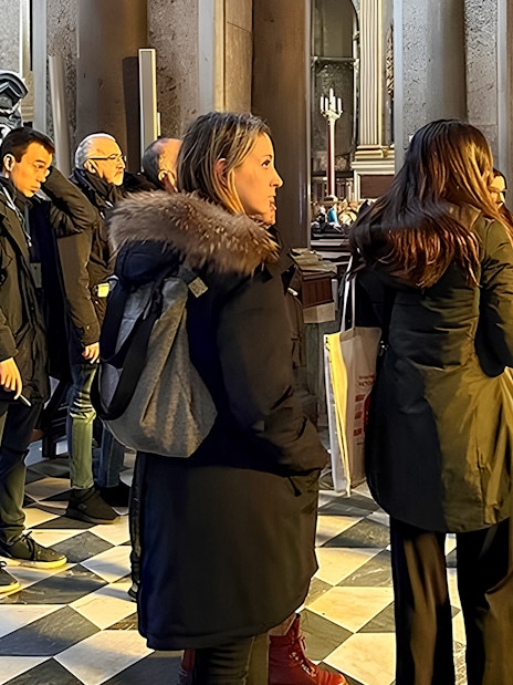 Visitors listening to a historian inside Sansevero Chapel, Naples.