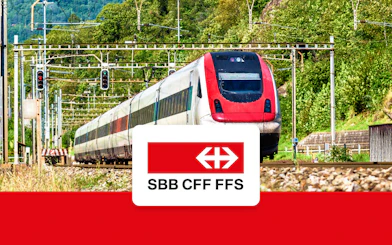 Train traveling through Swiss countryside, SBB CFF FFS logo, Zurich Airport to Zurich Central.