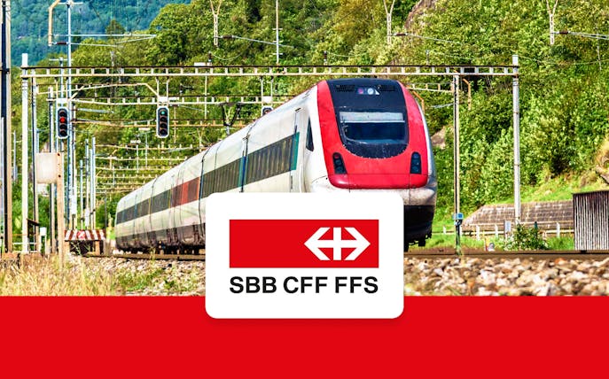 Train traveling through Swiss countryside, SBB CFF FFS logo, Zurich Airport to Zurich Central.
