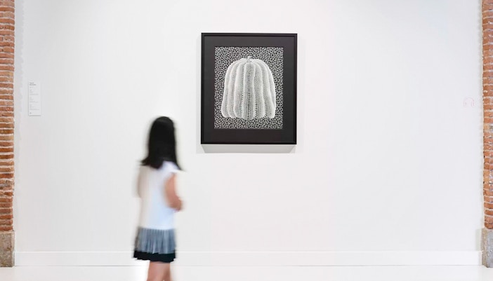 Yayoi Kusama's "Pumpkin White" artwork displayed at Moco Museum Barcelona.