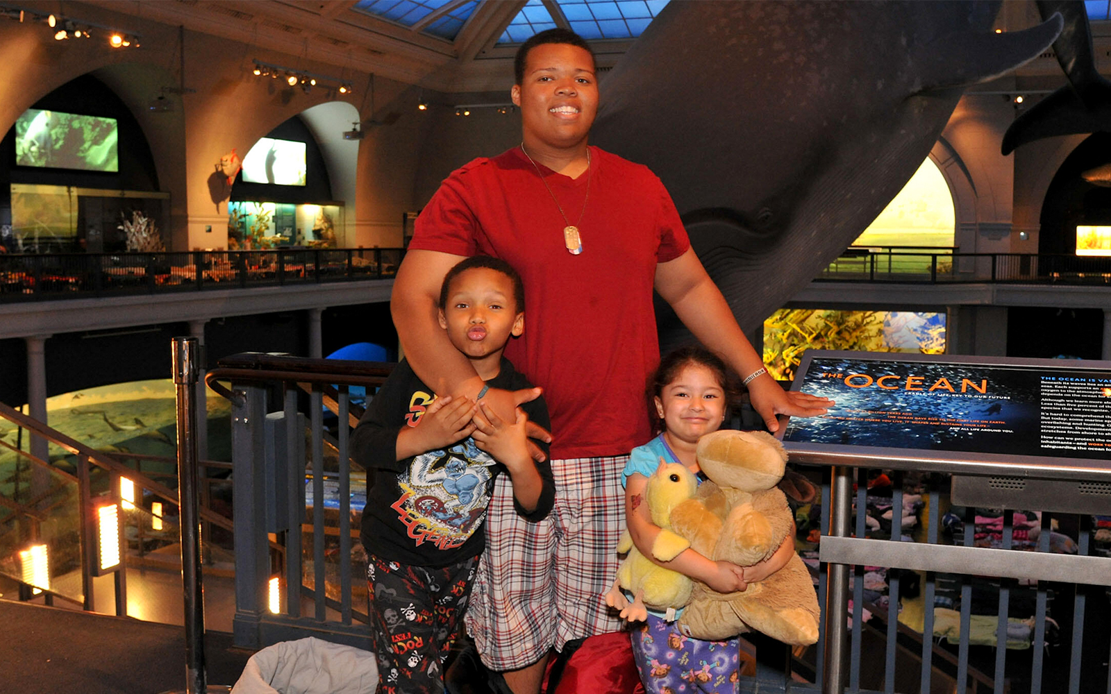 Children and families enjoying a sleepover at the American Museum of Natural History.