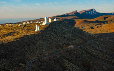 Teide Observatory at sunrise with mountainous landscape, Tenerife.