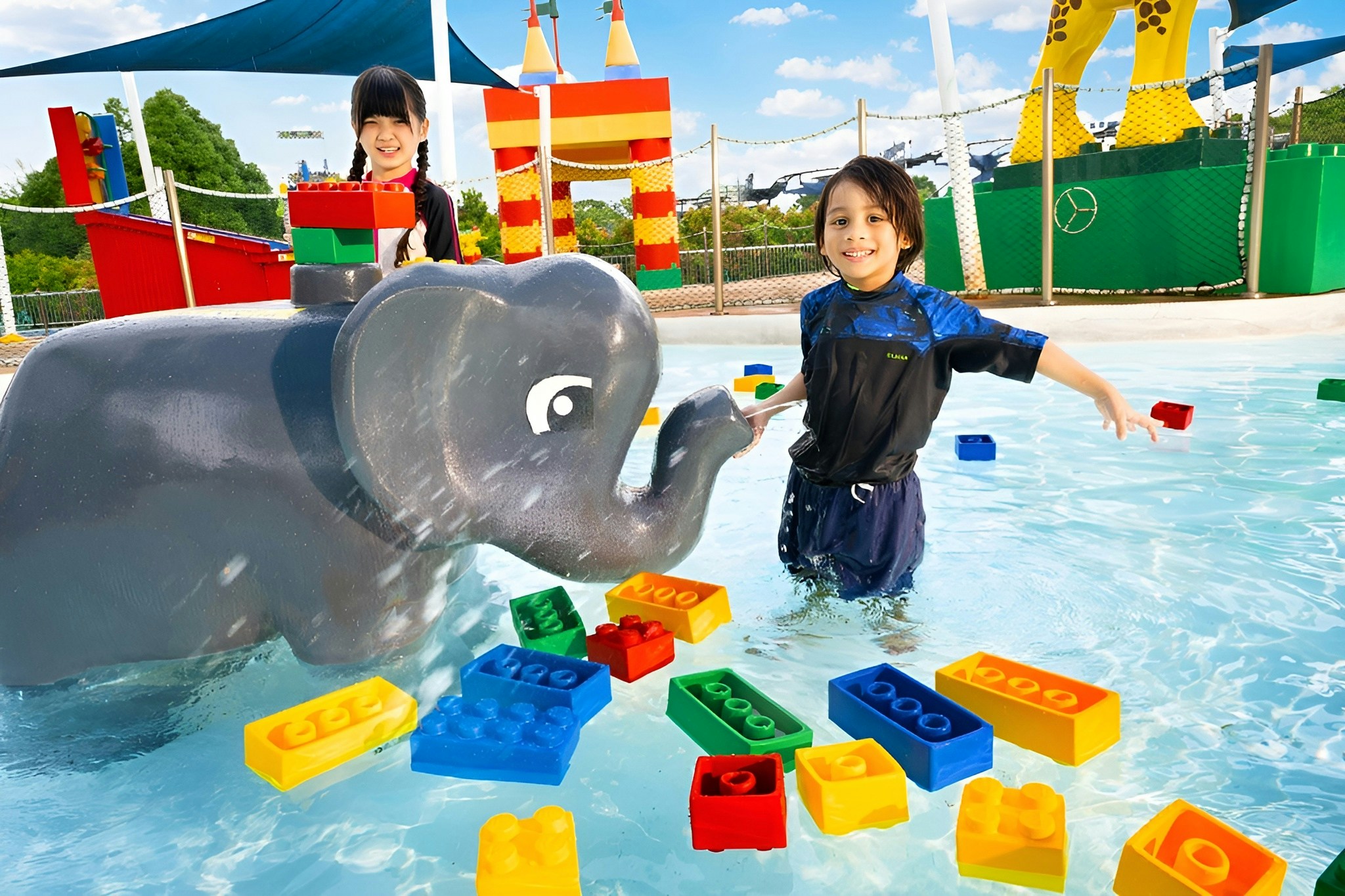 Children playing with Duplo blocks in the water at Splash Safari, Legoland Theme Park Malaysia.