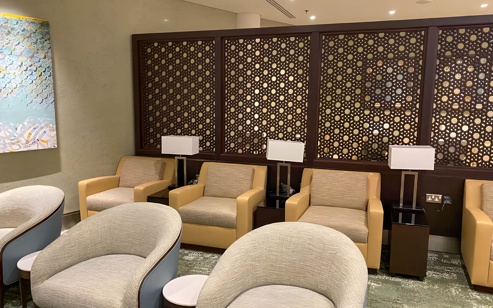Premium lounge seating area at Jeddah Airport with modern decor and comfortable chairs.