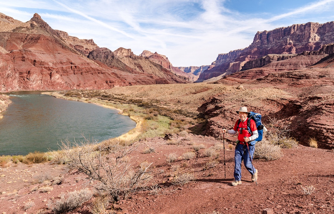 Hikers on Beamer Trail with scenic views of the Grand Canyon, Arizona.