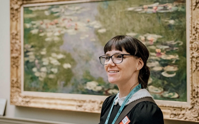 Guide in front of Monet’s Water Lilies at the Metropolitan Museum of Art.
