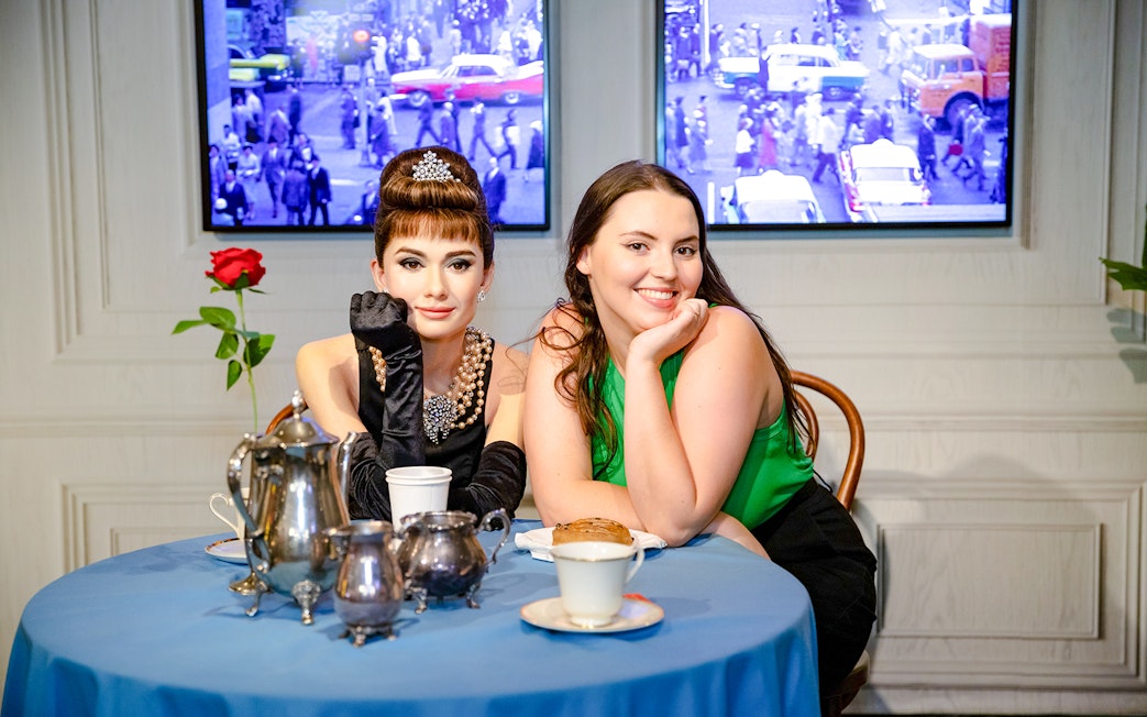 Wax figure of Audrey Hepburn with a visitor at Madame Tussauds Sydney.
