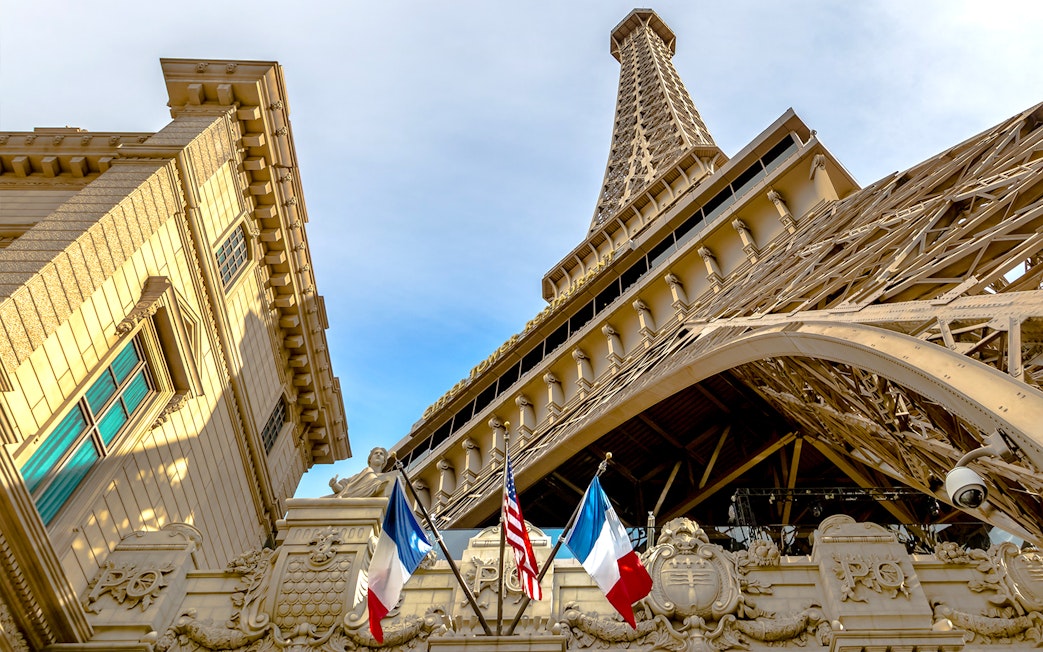 Eiffel Tower replica with French and American flags in Las Vegas.