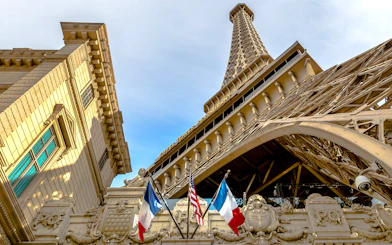 Eiffel Tower replica with French and American flags in Las Vegas.