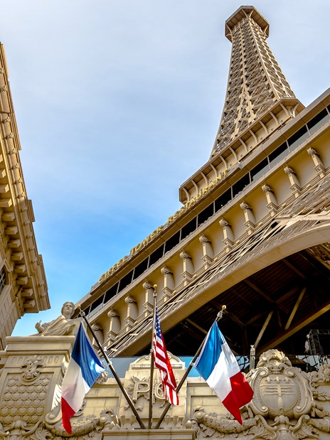 Eiffel Tower replica with French and American flags in Las Vegas.