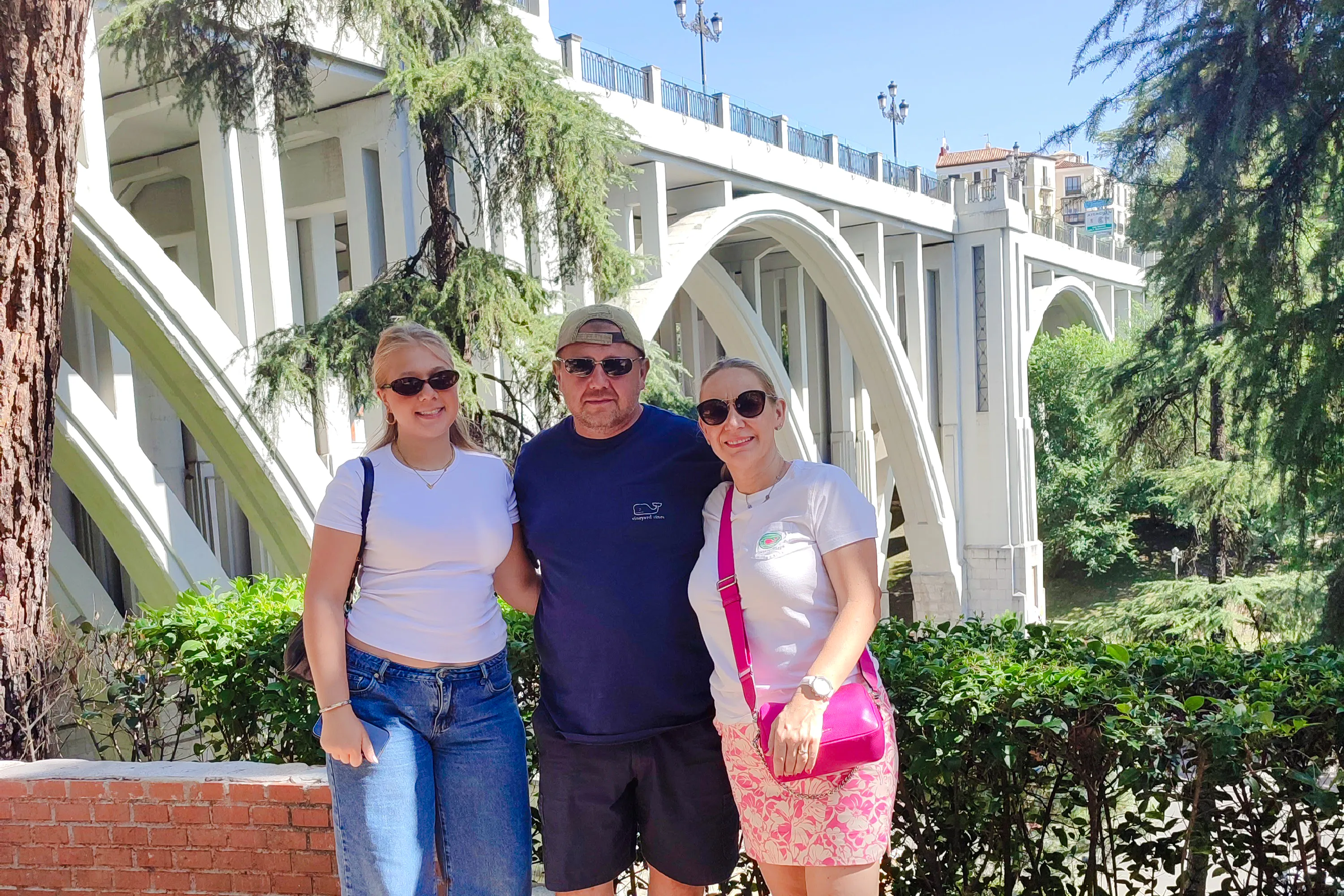 Tourists in front of Puente de Segovia during a private tour in Madrid.