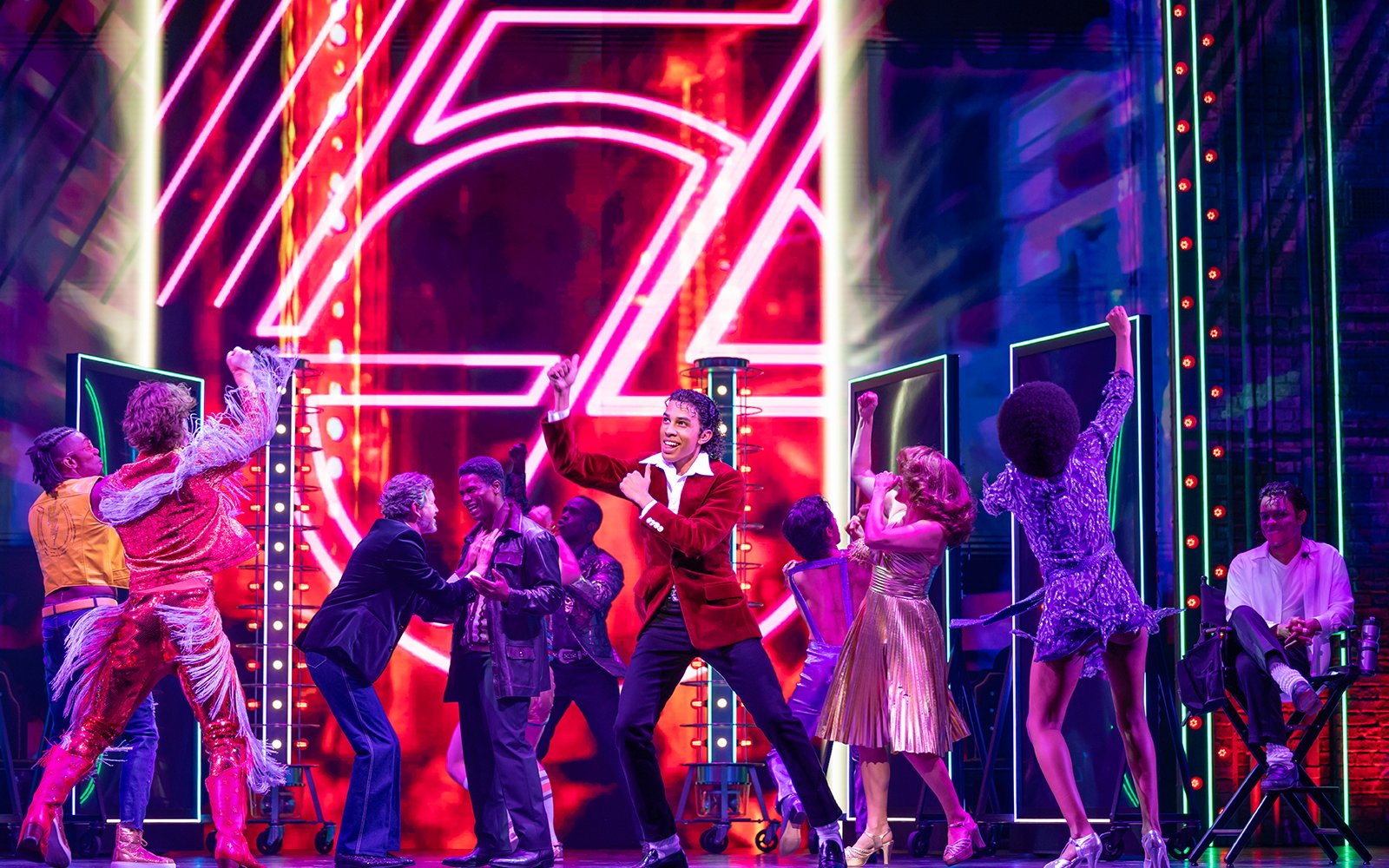 Stage performance of MJ the Musical in Brisbane with dancers in vibrant costumes.