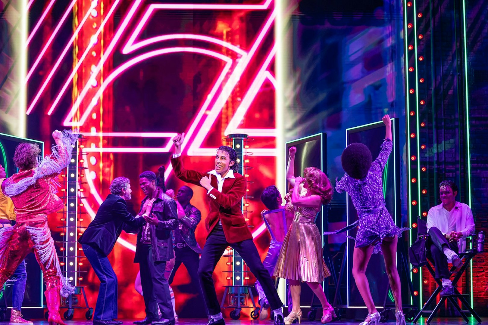 Stage performance of MJ the Musical in Brisbane with dancers in vibrant costumes.