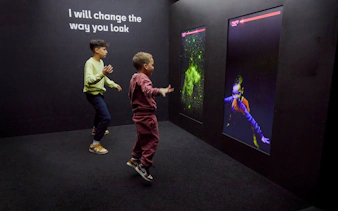 Guests interacting with digital displays at the Twist Museum in London.