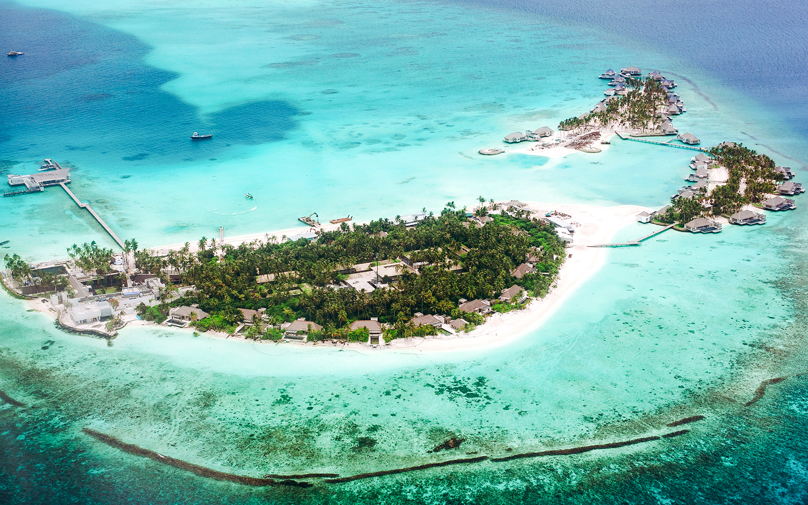 Aerial view of tropical island with turquoise waters, part of The Turquoise Experience Seaplane Tour, Mauritius.