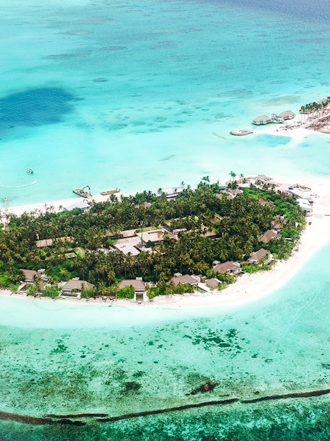 Aerial view of tropical island with turquoise waters, part of The Turquoise Experience Seaplane Tour, Mauritius.
