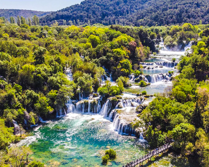 From Omiš: Krka National Park Guided Day Trip with Boat Ride and Swimming