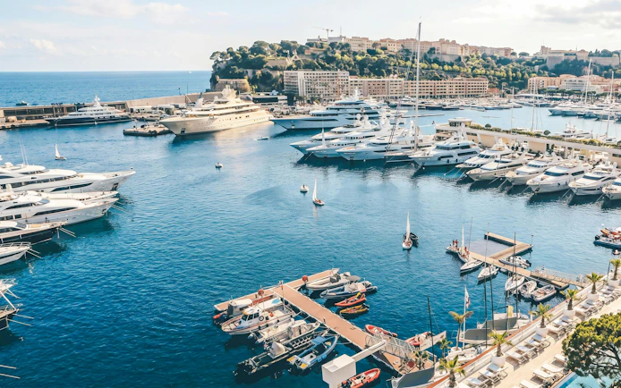 Villefranche boat tour with yachts in Monaco harbor.