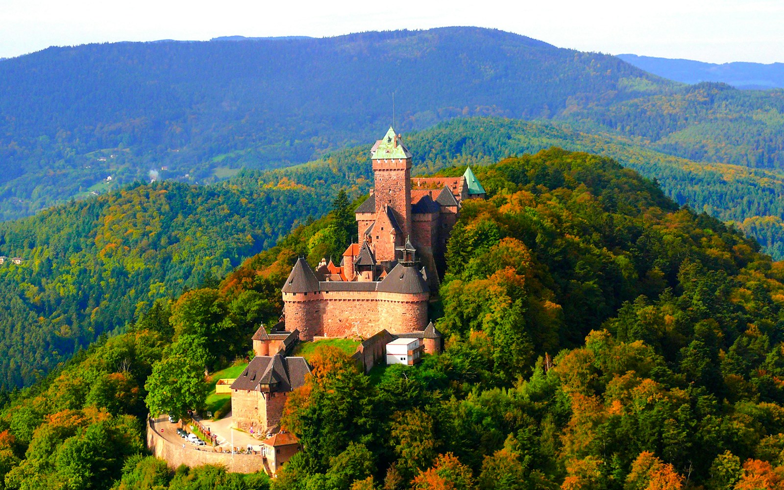 Haut Koenigsbourg Castle surrounded by dense forest in Alsace, France.