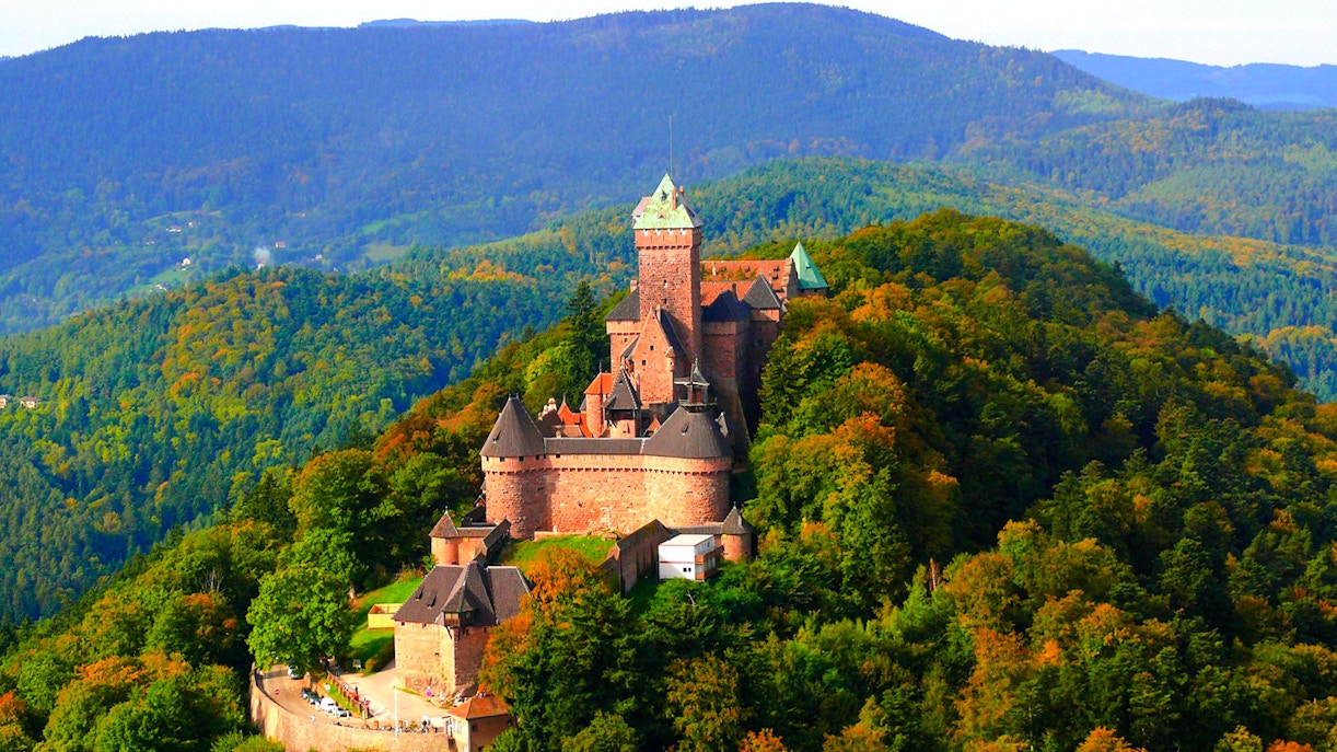 Haut Koenigsbourg Castle surrounded by dense forest in Alsace, France.