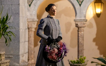 Woman in period costume at Palace of Pena during theatrical tour in Portugal.