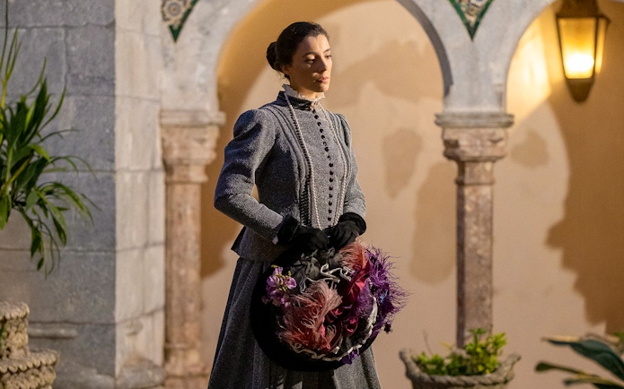 Woman in period costume at Palace of Pena during theatrical tour in Portugal.