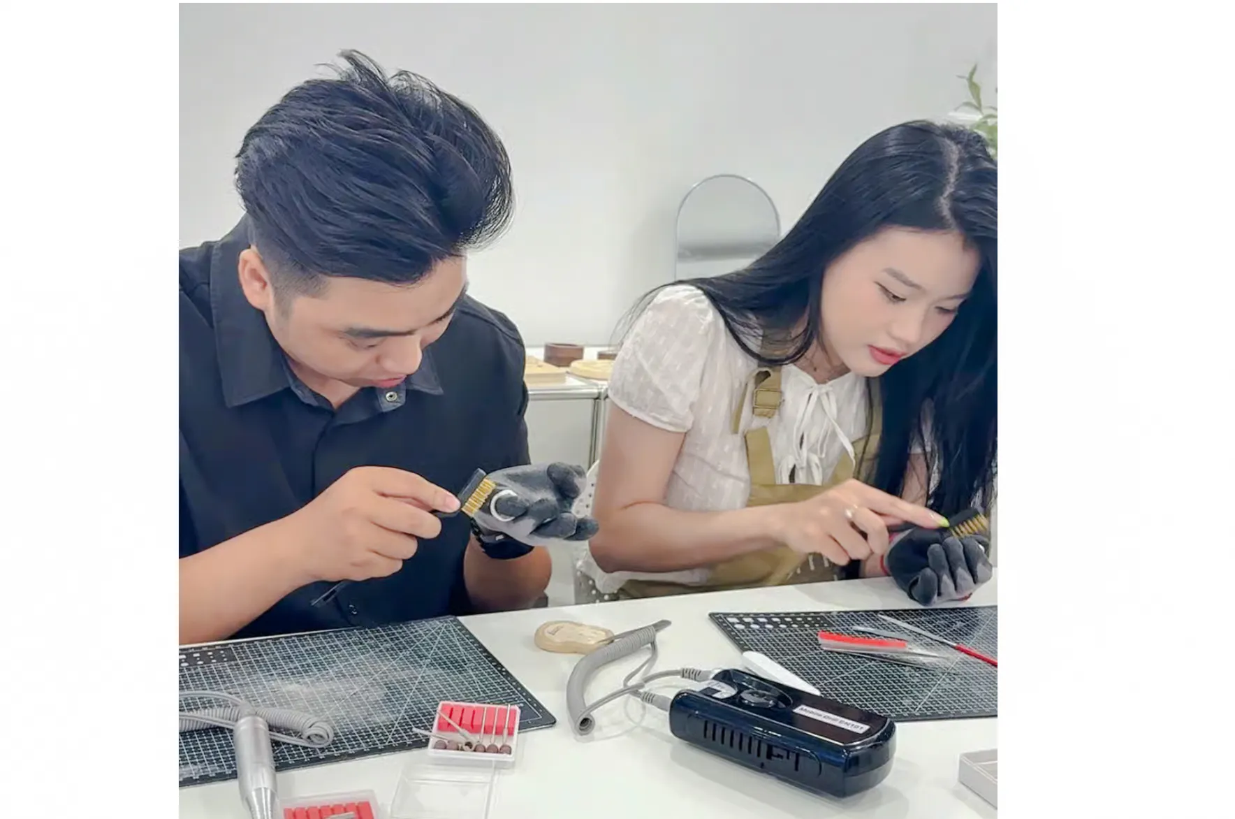 Participants crafting silver jewelry in a Da Nang workshop.