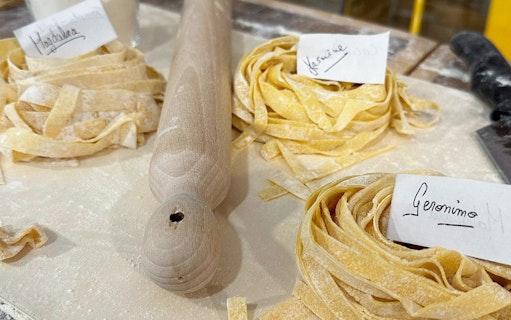Fresh pasta dough with name tags at a cooking class in Rome.