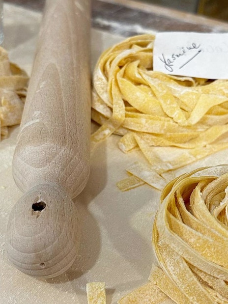 Fresh pasta dough with name tags at a cooking class in Rome.