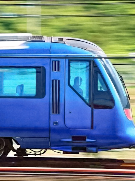 High-speed train traveling between Hong Kong International Airport and city center.