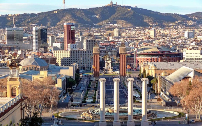 Plaça d'Espanya in Barcelona with Venetian Towers and Montjuïc in the background.