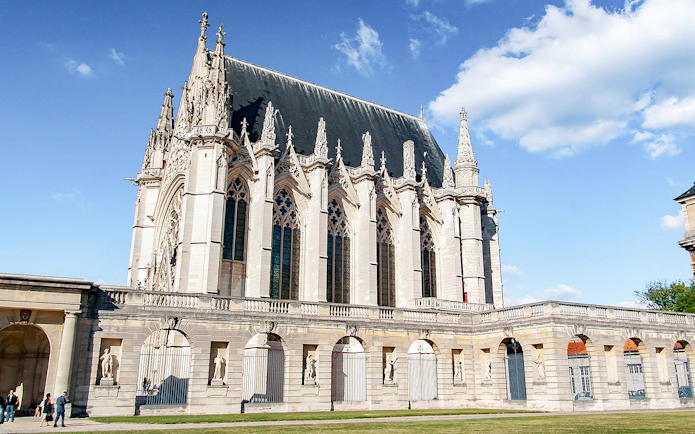 Gothic chapel at Château de Vincennes, Paris, with ornate spires and arches.