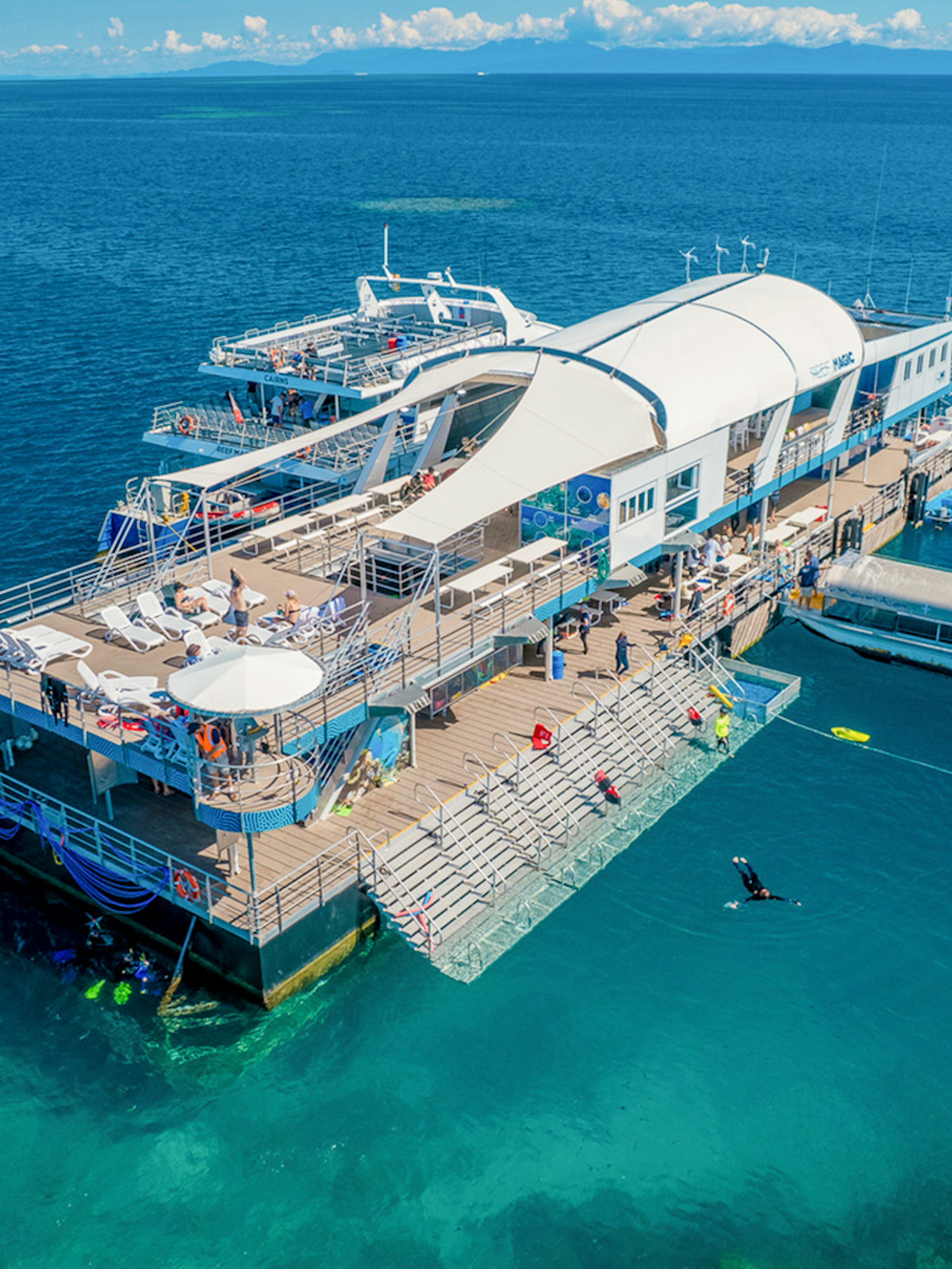 Aerial view of a pontoon with tourists in the Great Barrier Reef, Australia.