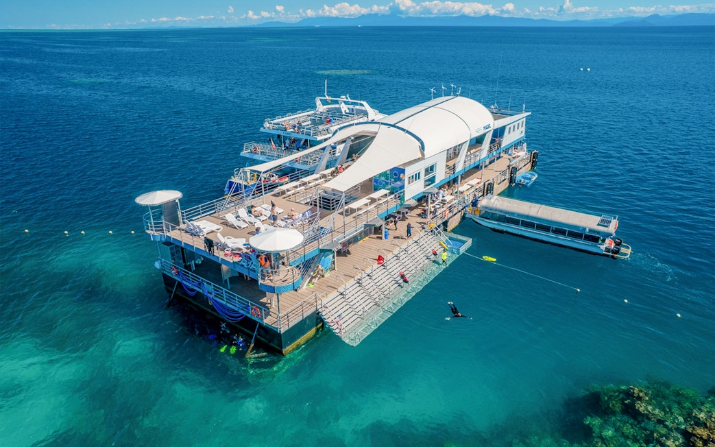 Aerial view of a pontoon with tourists in the Great Barrier Reef, Australia.