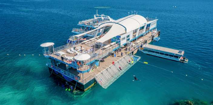 Aerial view of a pontoon with tourists in the Great Barrier Reef, Australia.