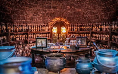 Potions classroom with cauldrons and shelves of bottles, Harry Potter London tour.