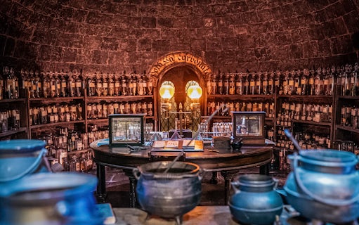 Potions classroom with cauldrons and shelves of bottles, Harry Potter London tour.
