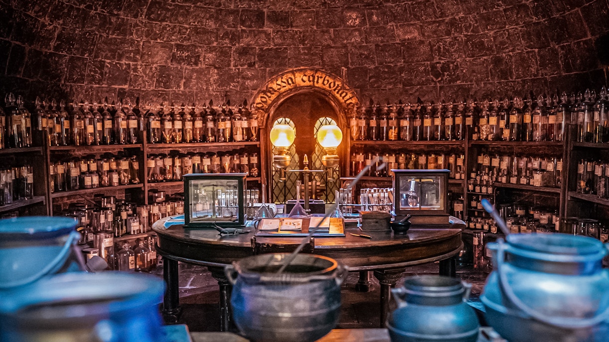 Potions classroom with cauldrons and shelves of bottles, Harry Potter London tour.