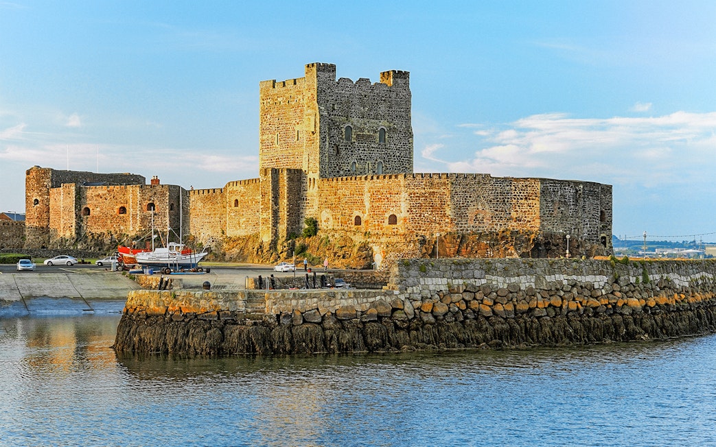 Carrickfergus Castle by the water, featured in Game of Thrones location tour.