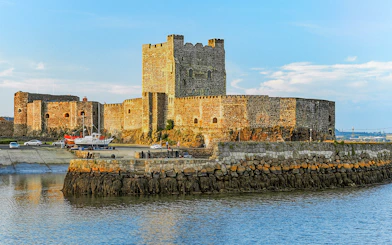 Carrickfergus Castle by the water, featured in Game of Thrones location tour.