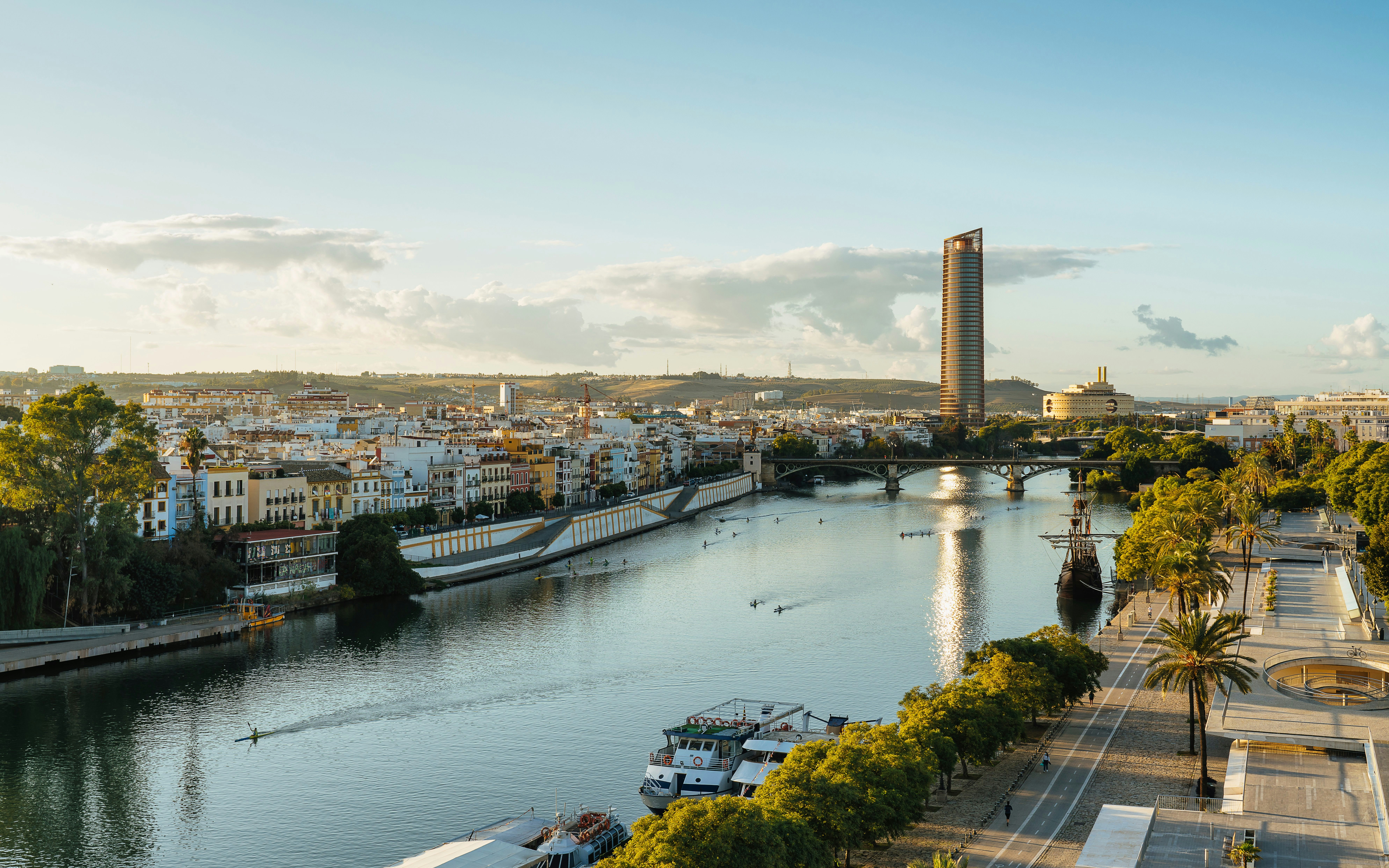 Panoramic view of Guadalquivir River with Triana and Seville Tower, Spain.