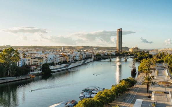 Panoramic view of Guadalquivir River with Triana and Seville Tower, Spain.