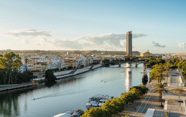 Panoramic view of Guadalquivir River with Triana and Seville Tower, Spain.