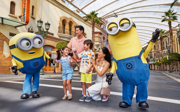 Family enjoying time with Minions at Universal Studios Singapore.