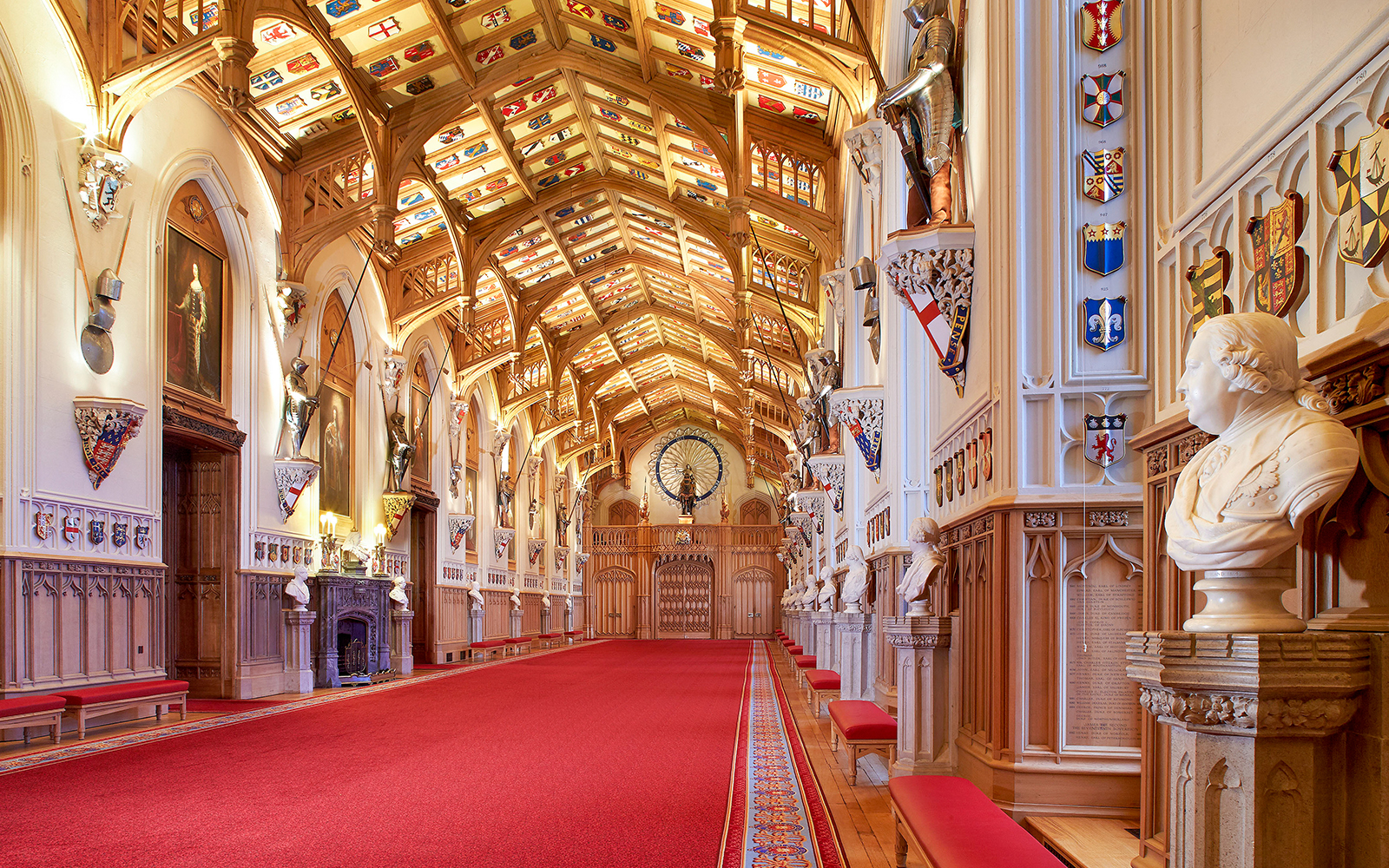 St George's Hall interior with ornate ceiling and red carpet in Windsor Castle.