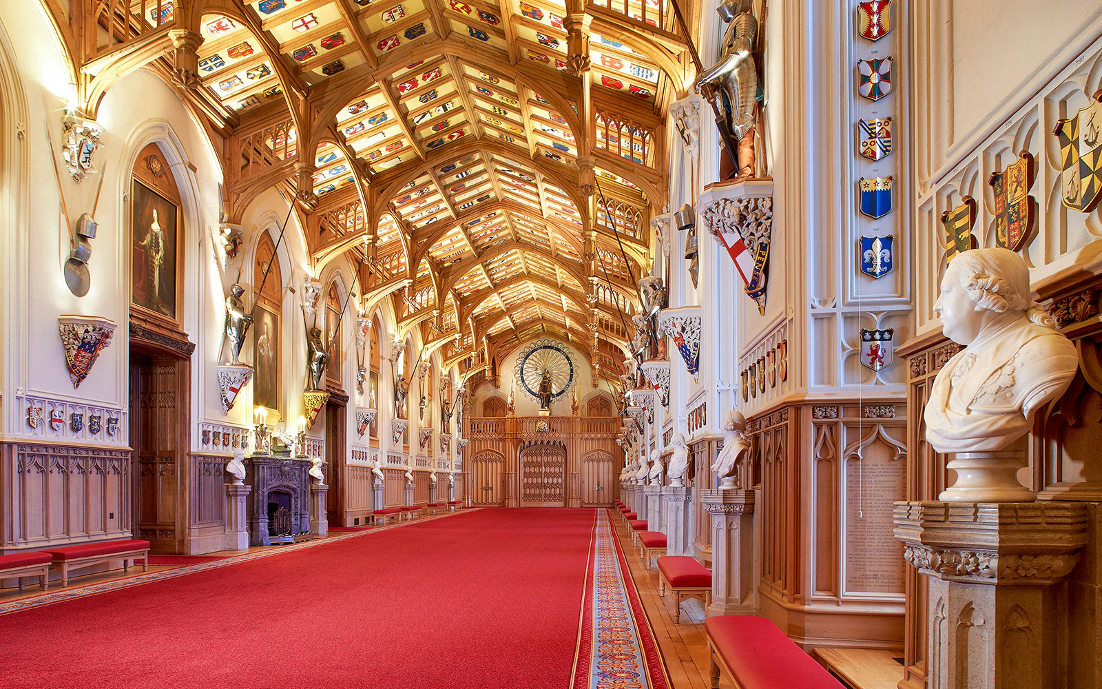 St George's Hall interior with ornate ceiling and red carpet in Windsor Castle.