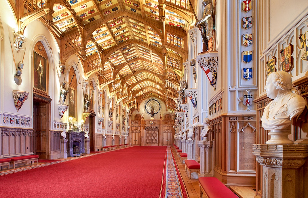 St George's Hall interior with ornate ceiling and red carpet in Windsor Castle.